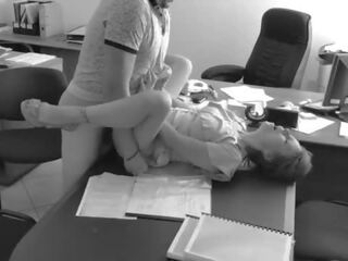 The boss fucks his tiny secretary on the office table and shows it on hidden camera